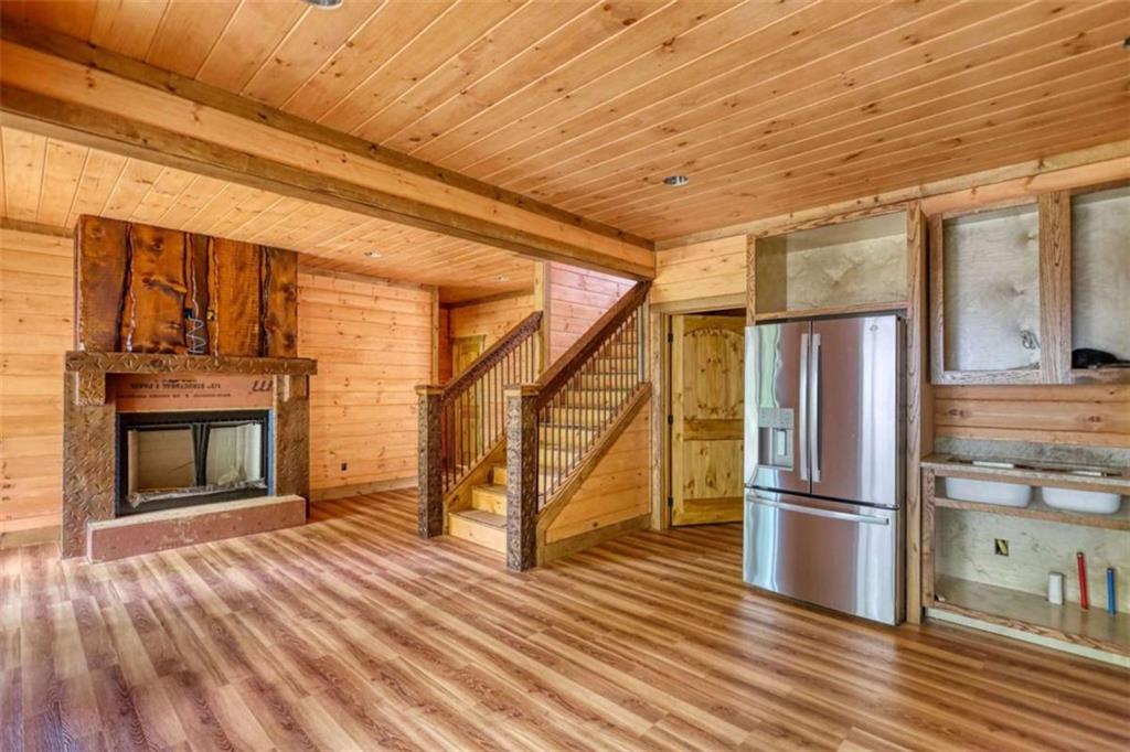485 Church Street Blue Ridge, GA 30513 - Photo 29 of 85 a view of empty room with wooden floor and fireplace