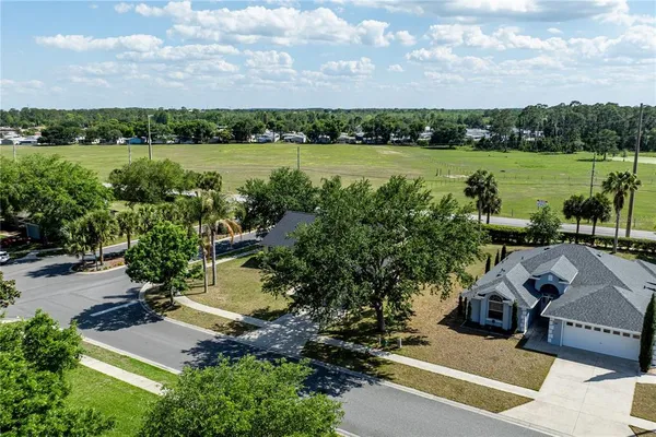 an aerial view of a house having yard