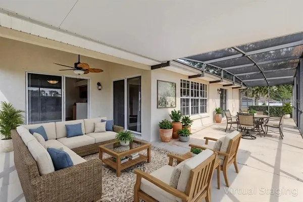 a outdoor living space with patio furniture and potted plants