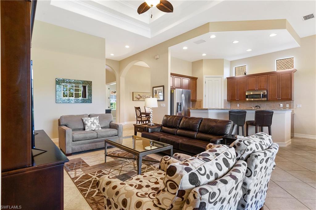 7794 Ashton Road Naples, FL 34113 - Photo 13 of 34 a living room with furniture and a couch