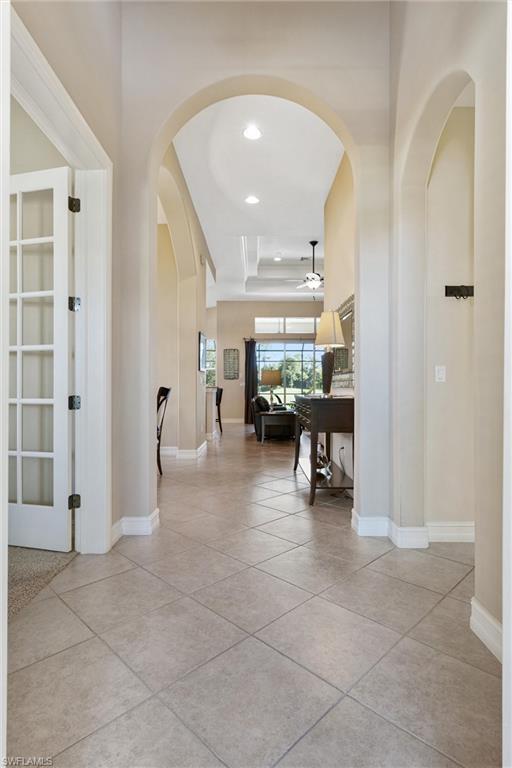 7794 Ashton Road Naples, FL 34113 - Photo 2 of 34 a lobby with furniture and a large window
