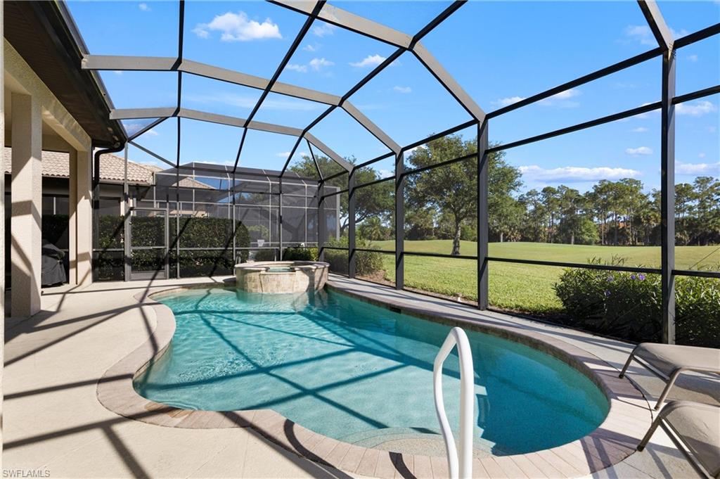 7794 Ashton Road Naples, FL 34113 - Photo 23 of 34 a view of a swimming pool with a patio