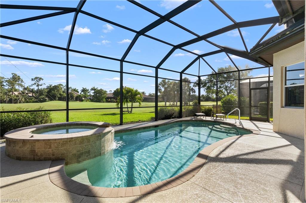 7794 Ashton Road Naples, FL 34113 - Photo 24 of 34 a view of a swimming pool with a patio