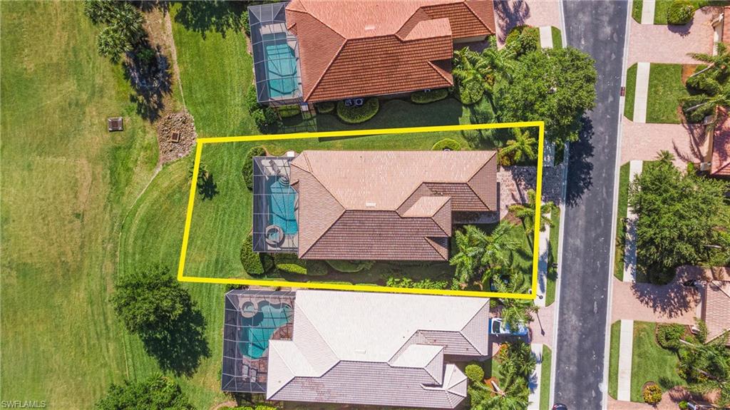 7794 Ashton Road Naples, FL 34113 - Photo 31 of 34 an aerial view of a house with a garden and a yard