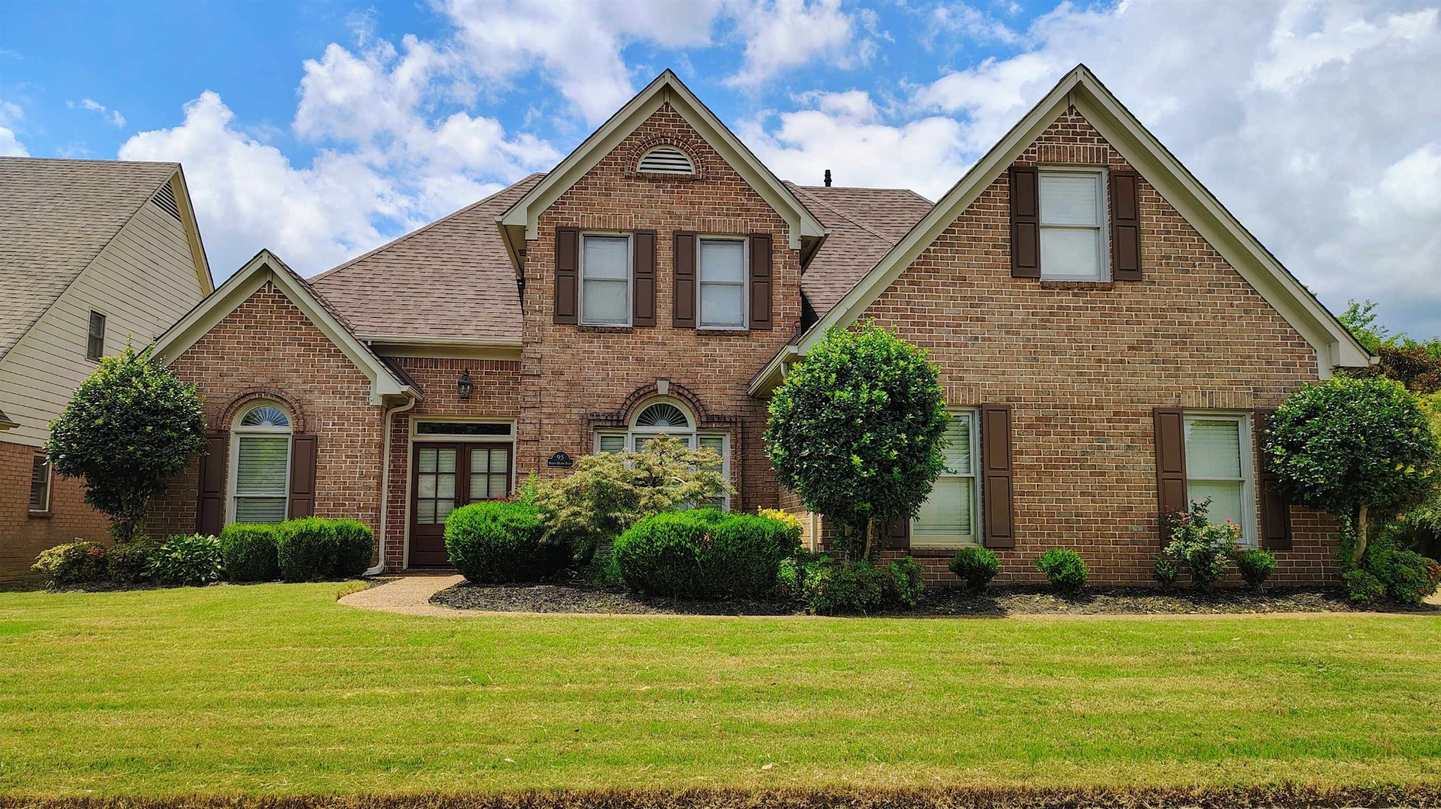 95 Morris Manor Drive Collierville, TN 38017 - Photo 1 of 35 a front view of a house with a yard