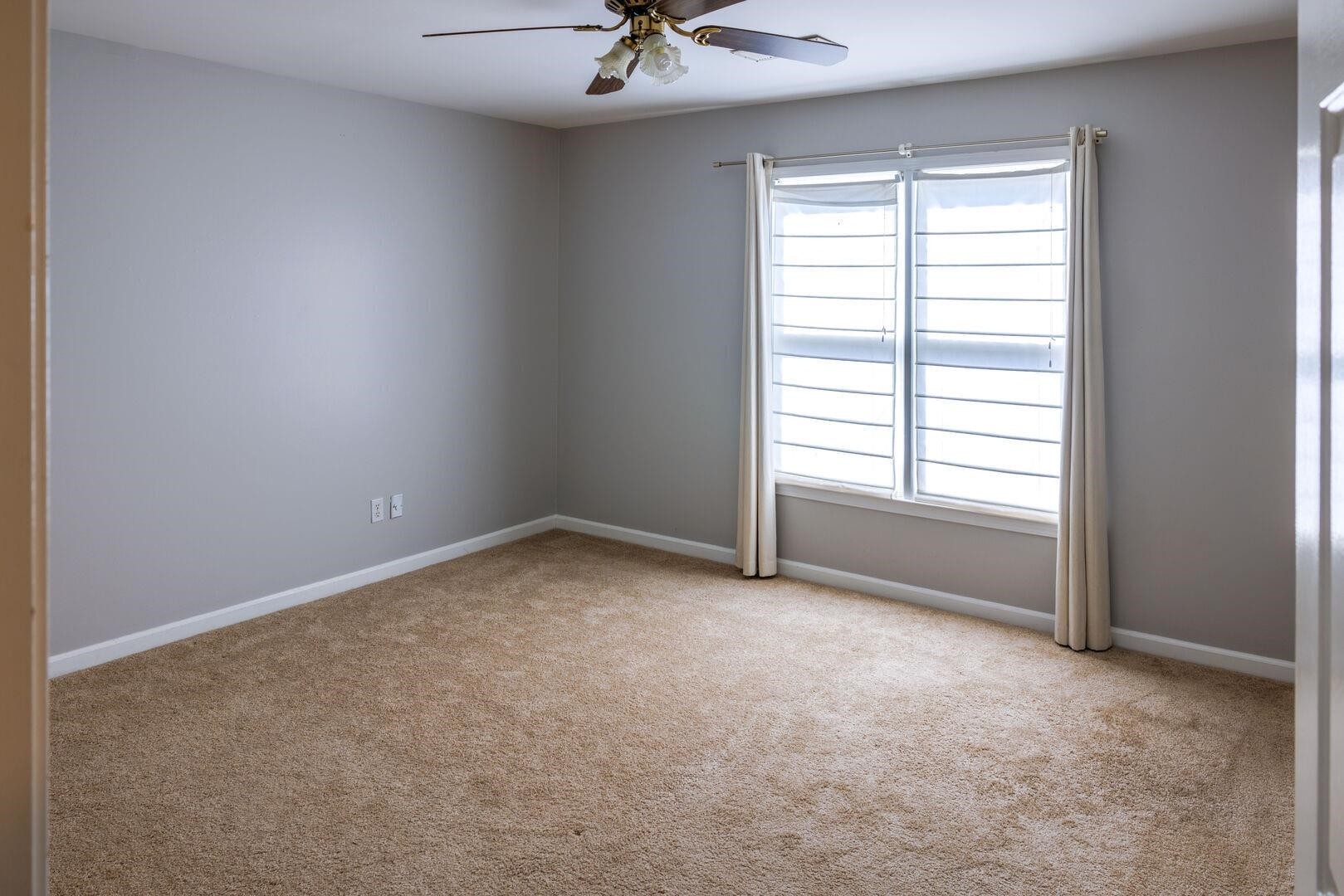 95 Morris Manor Drive Collierville, TN 38017 - Photo 23 of 35 an empty room with a window and a fan