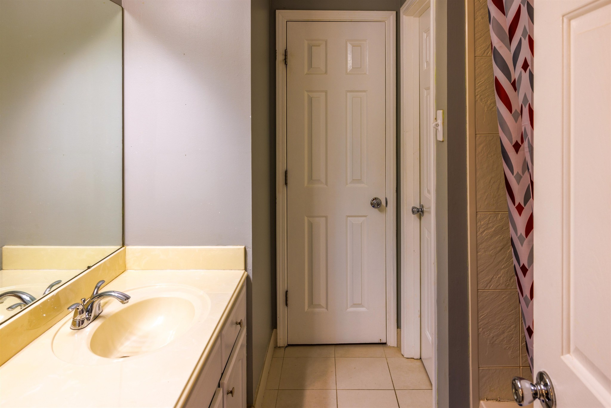 95 Morris Manor Drive Collierville, TN 38017 - Photo 26 of 35 a bathroom with a granite countertop sink and a mirror