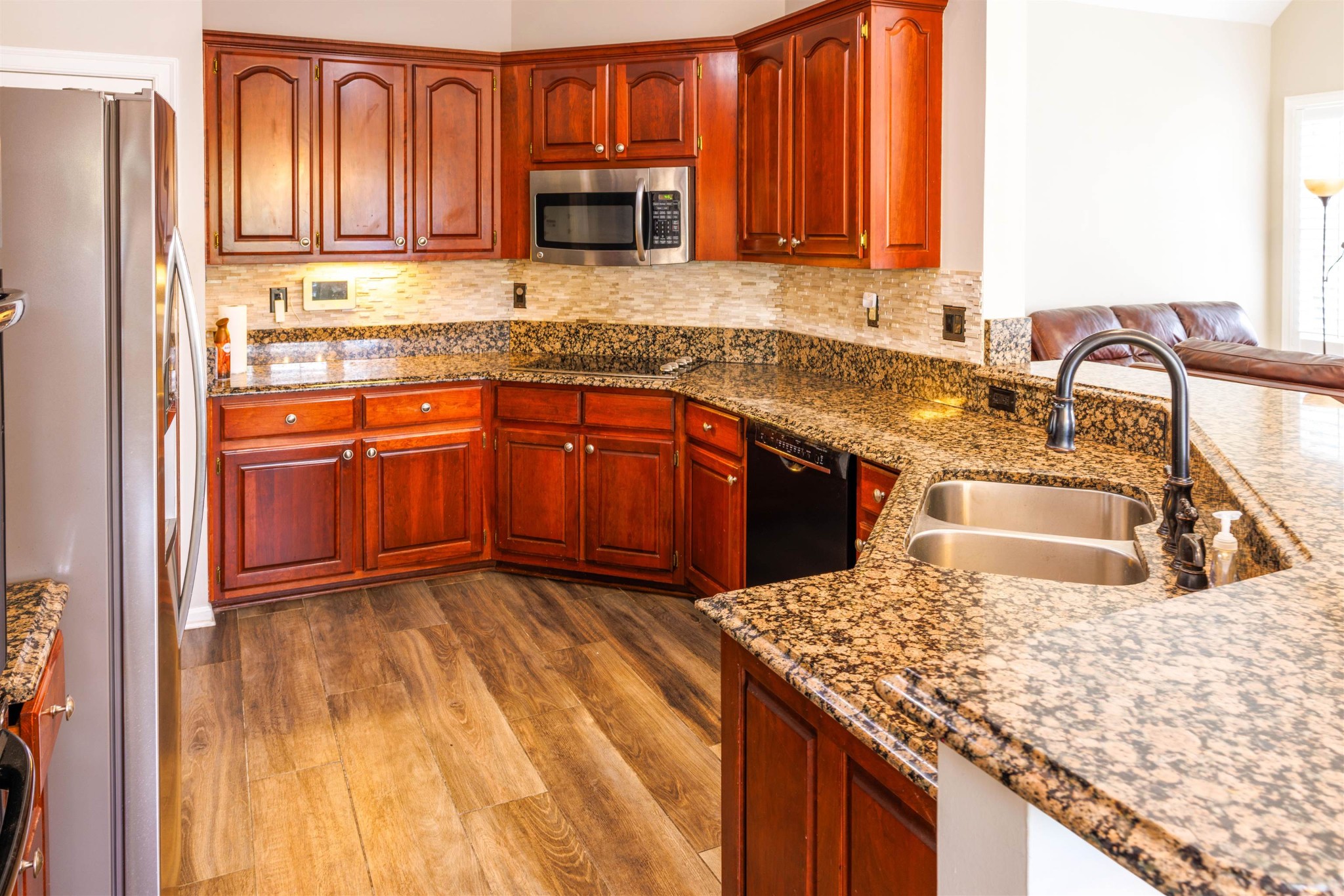 95 Morris Manor Drive Collierville, TN 38017 - Photo 5 of 35 a kitchen with stainless steel appliances granite countertop a sink a stove and cabinets