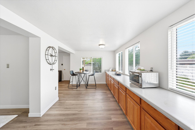 215 Carol Way Midvale, UT 84047 - Photo 14 of 30 Long kitchen buffett counter top with ample cabinet space. Kitchen dinnng area.