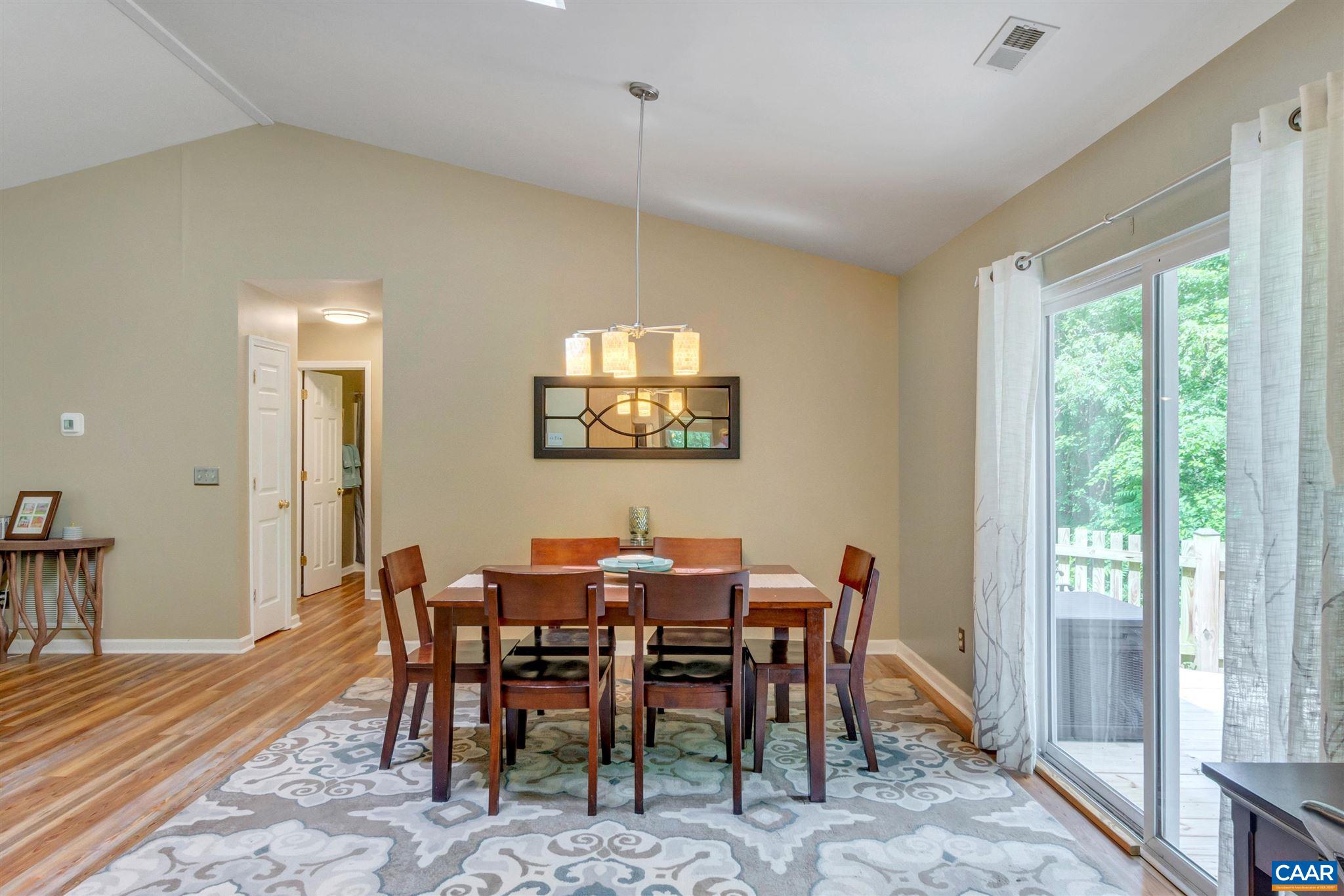 352 East Daffodil Road Ruckersville, VA 22968 - Photo 11 of 36 a view of a dining room with furniture window and wooden floor