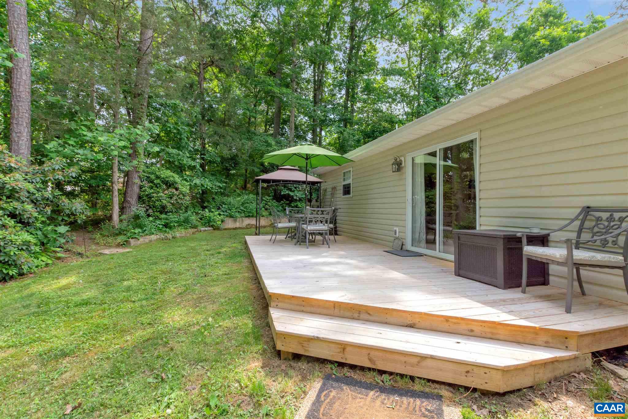 352 East Daffodil Road Ruckersville, VA 22968 - Photo 31 of 36 a view of a patio with a table chairs and a barbeque