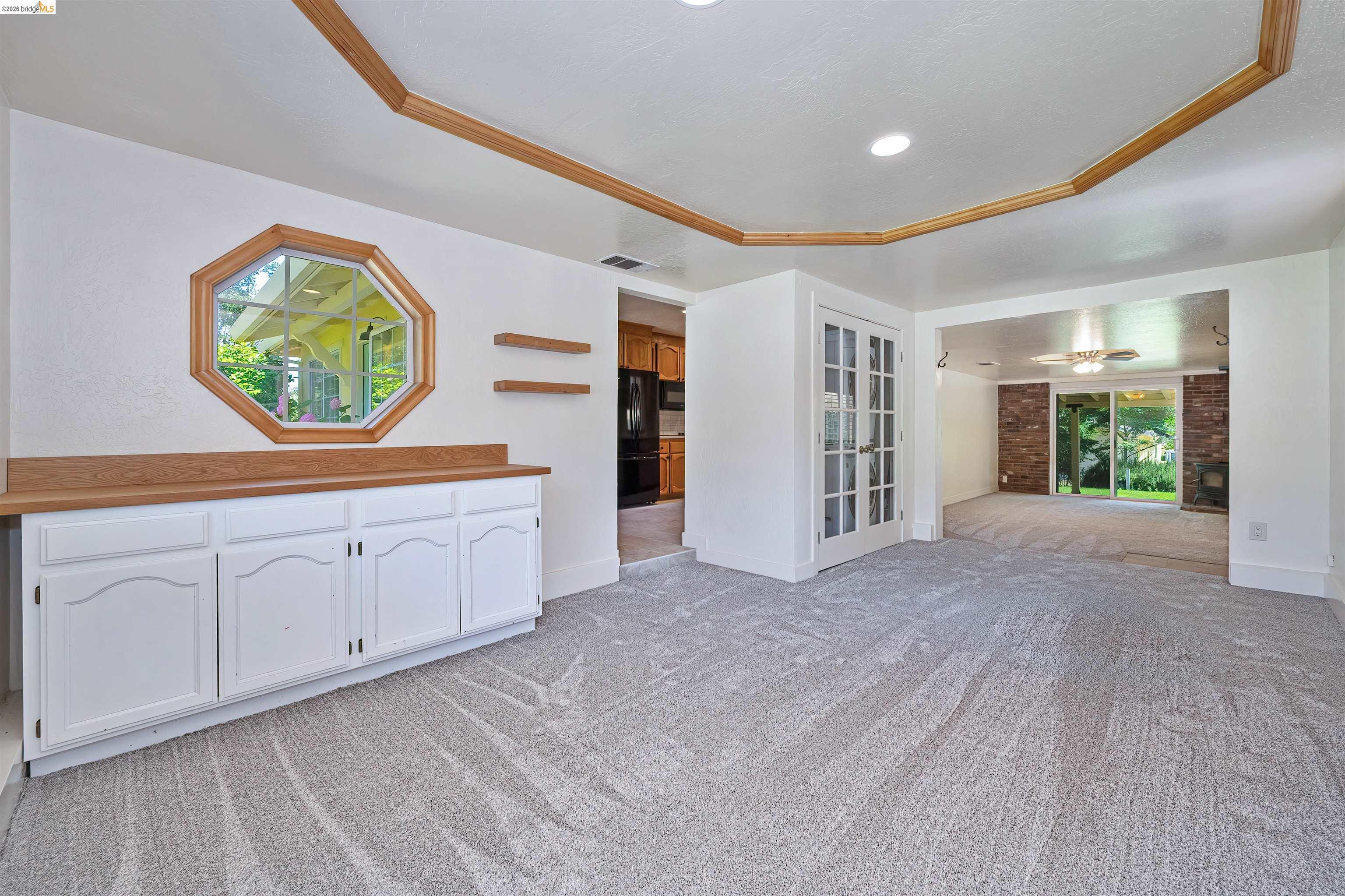 10474 Sheldon Road Elk Grove, CA 95624 - Photo 16 of 83 Spacious interior featuring light gray patterned carpeting and recessed lighting