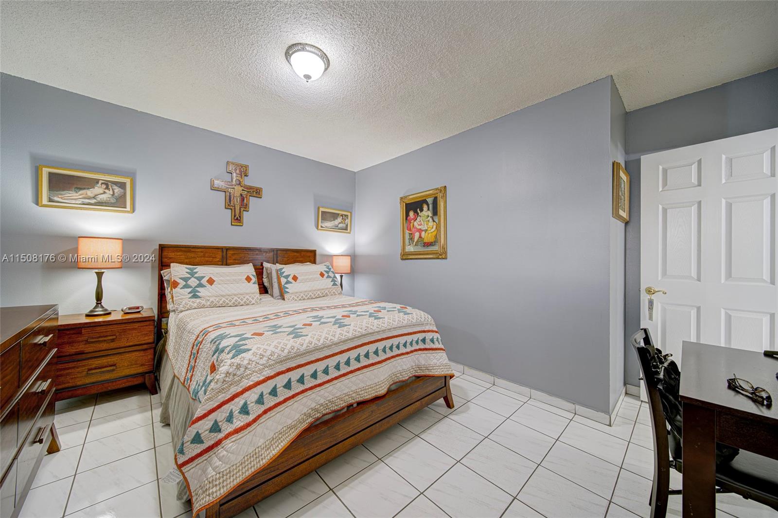 Coral Gate Miami, FL 33145 - Photo 14 of 35 a bedroom with a bed and a table in it