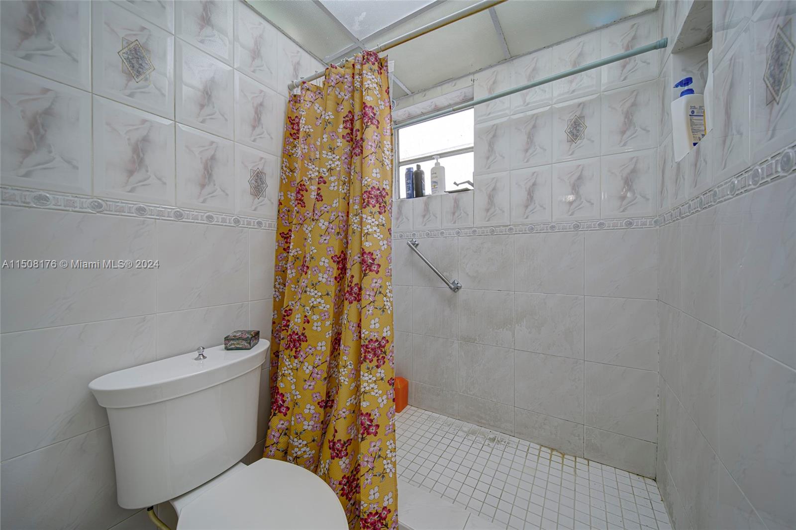 Coral Gate Miami, FL 33145 - Photo 16 of 35 a bathroom with a toilet and shower