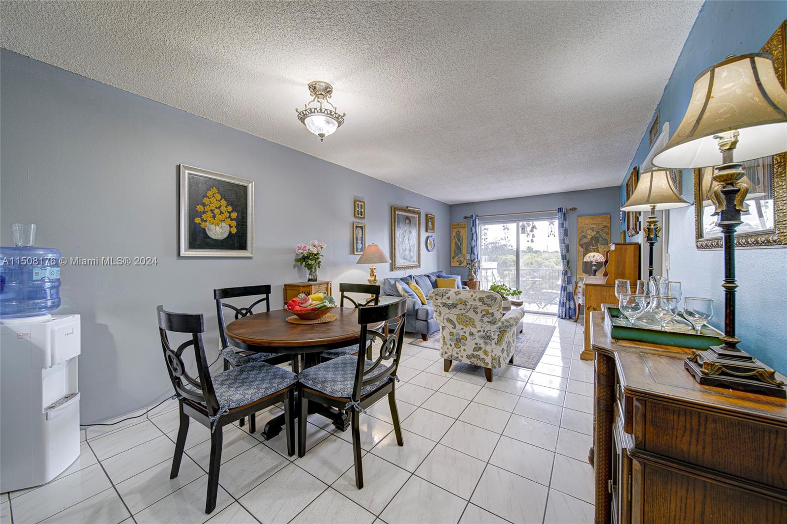 Coral Gate Miami, FL 33145 - Photo 18 of 35 a living room with furniture a chandelier and a dining table