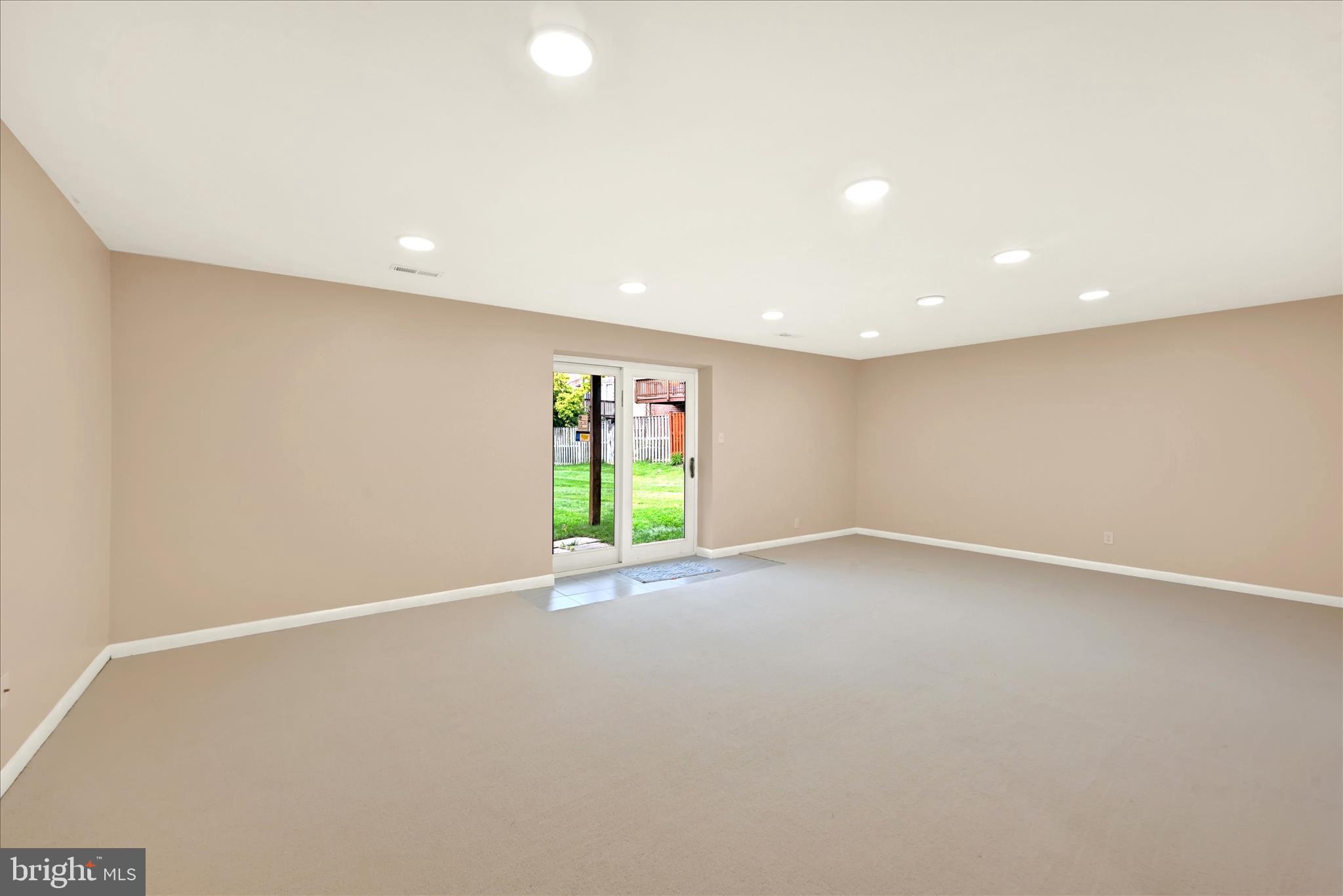 2317 Wonderview Road Lutherville-Timonium, MD 21093 - Photo 23 of 27 an empty room with a window and a projector screen
