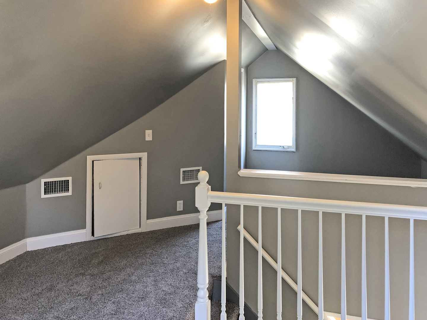 Undisclosed Address Round Lake Beach, IL 60073 - Photo 7 of 8 a view of a hallway with windows