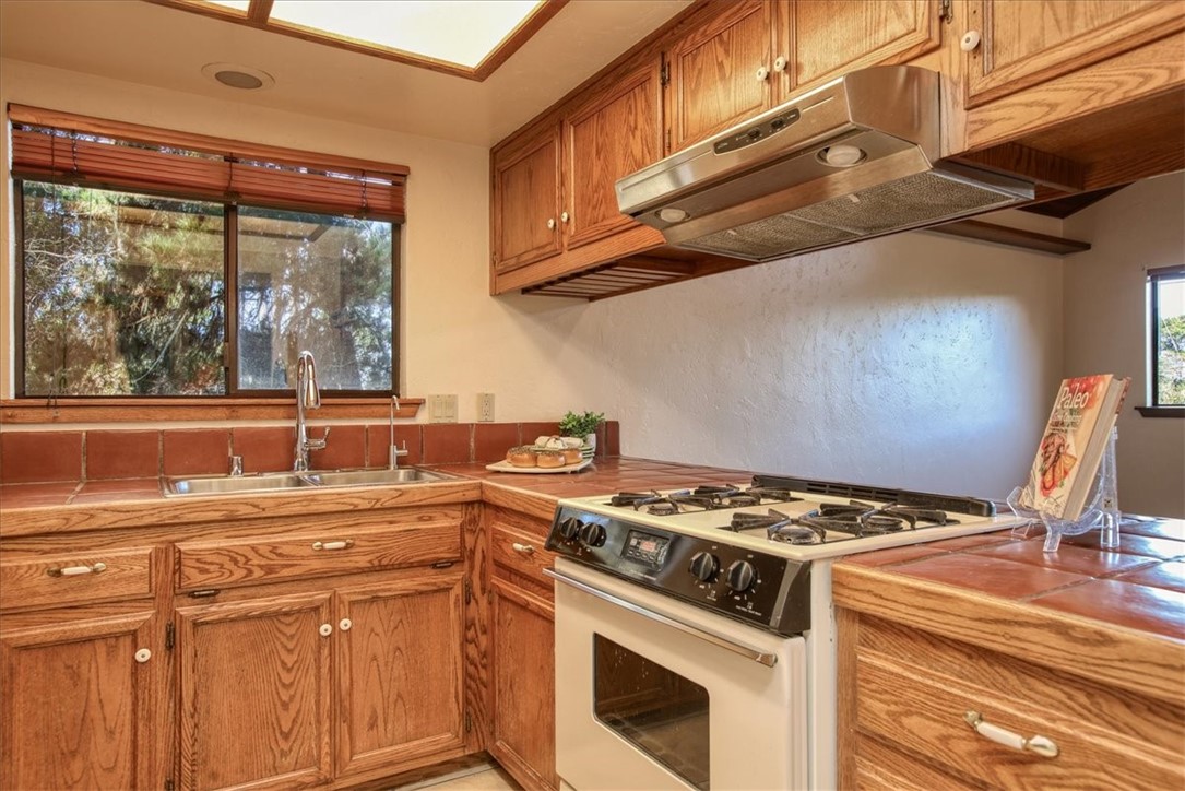 2550 Emerson Road Cambria, CA 93428 - Photo 19 of 49 a kitchen with stainless steel appliances granite countertop a stove and a sink