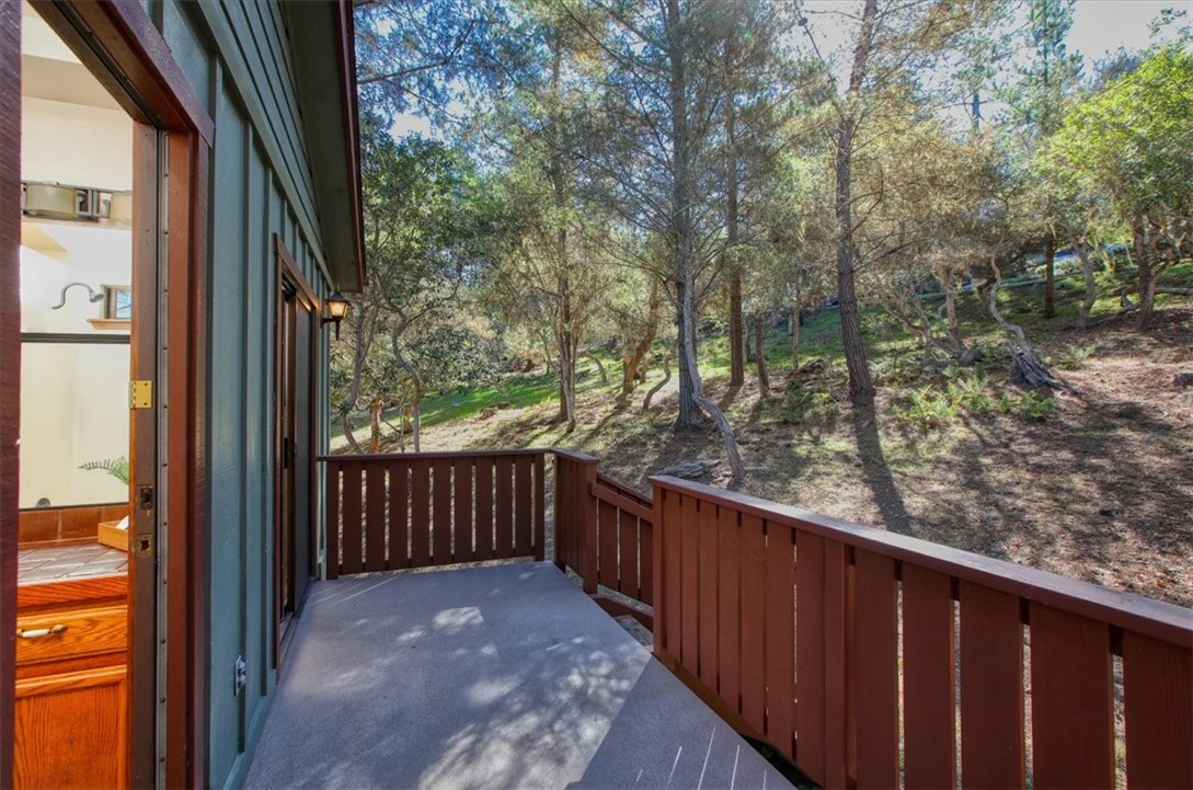 2550 Emerson Road Cambria, CA 93428 - Photo 36 of 49 a balcony with wooden floor and fence