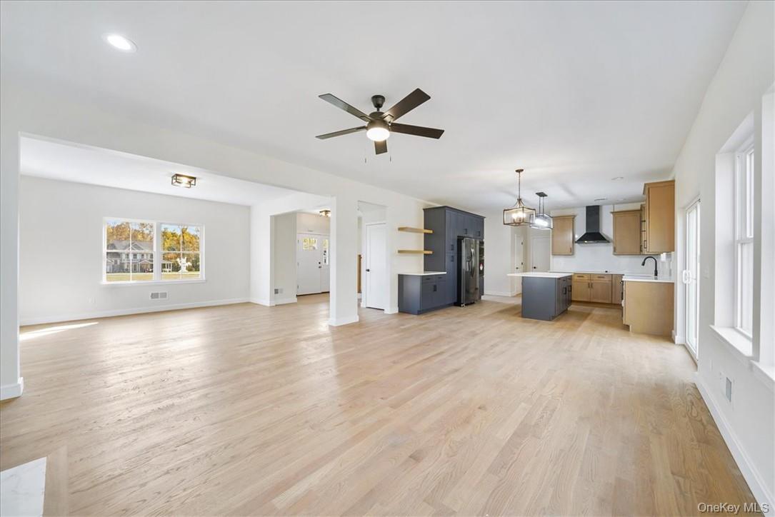 Lot 18-20 Silo Ridge Drive Wallkill, NY 12589 - Photo 8 of 37 Unfurnished living room with ceiling fan, light hardwood / wood-style flooring, and sink