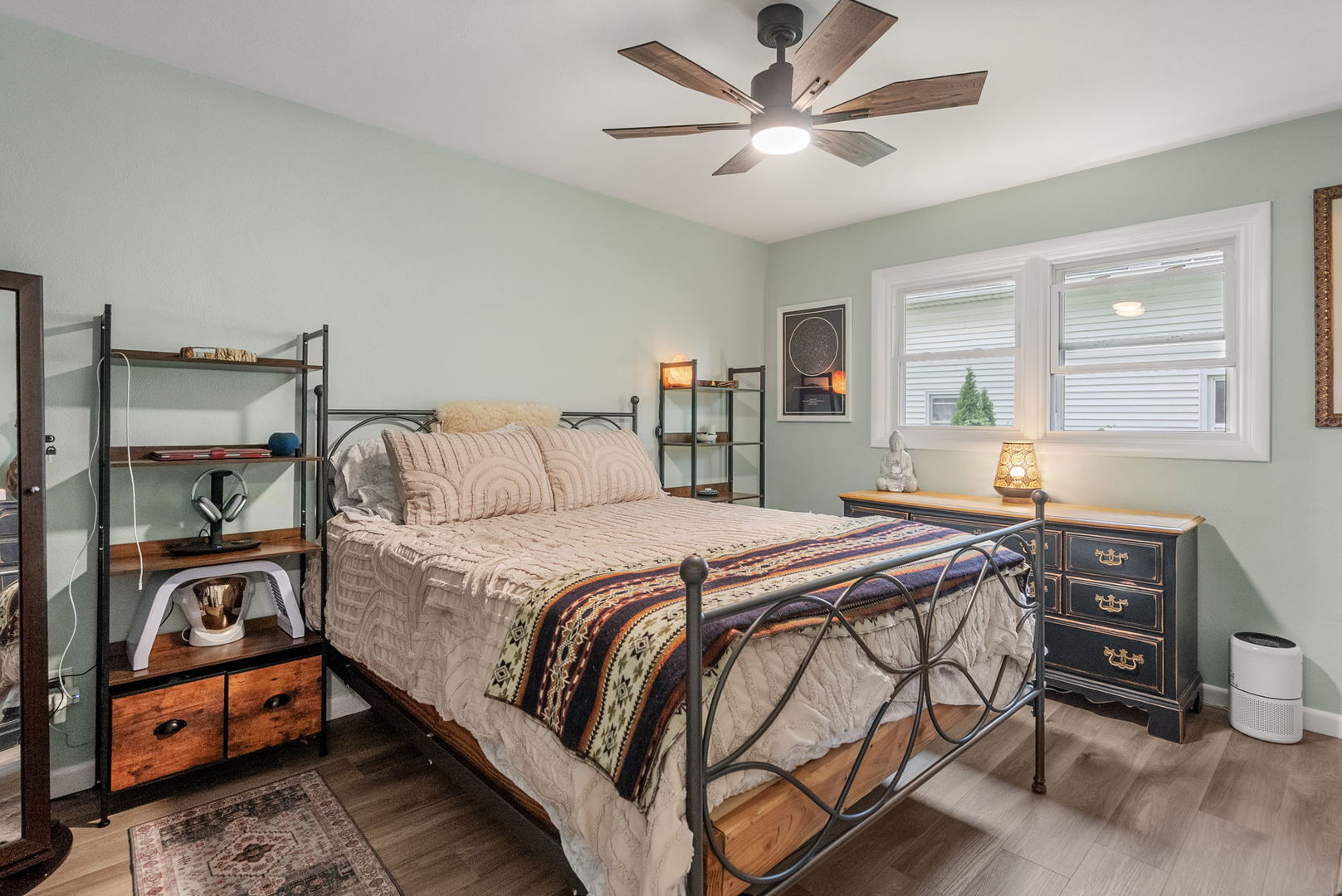 1435 26th Avenue Moline, IL 61265 - Photo 12 of 38 a bedroom with a bed and a chandelier