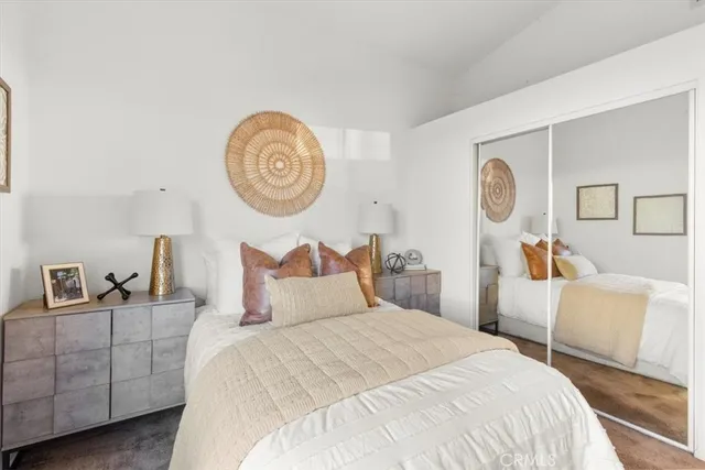 a bedroom with bed and a lamp