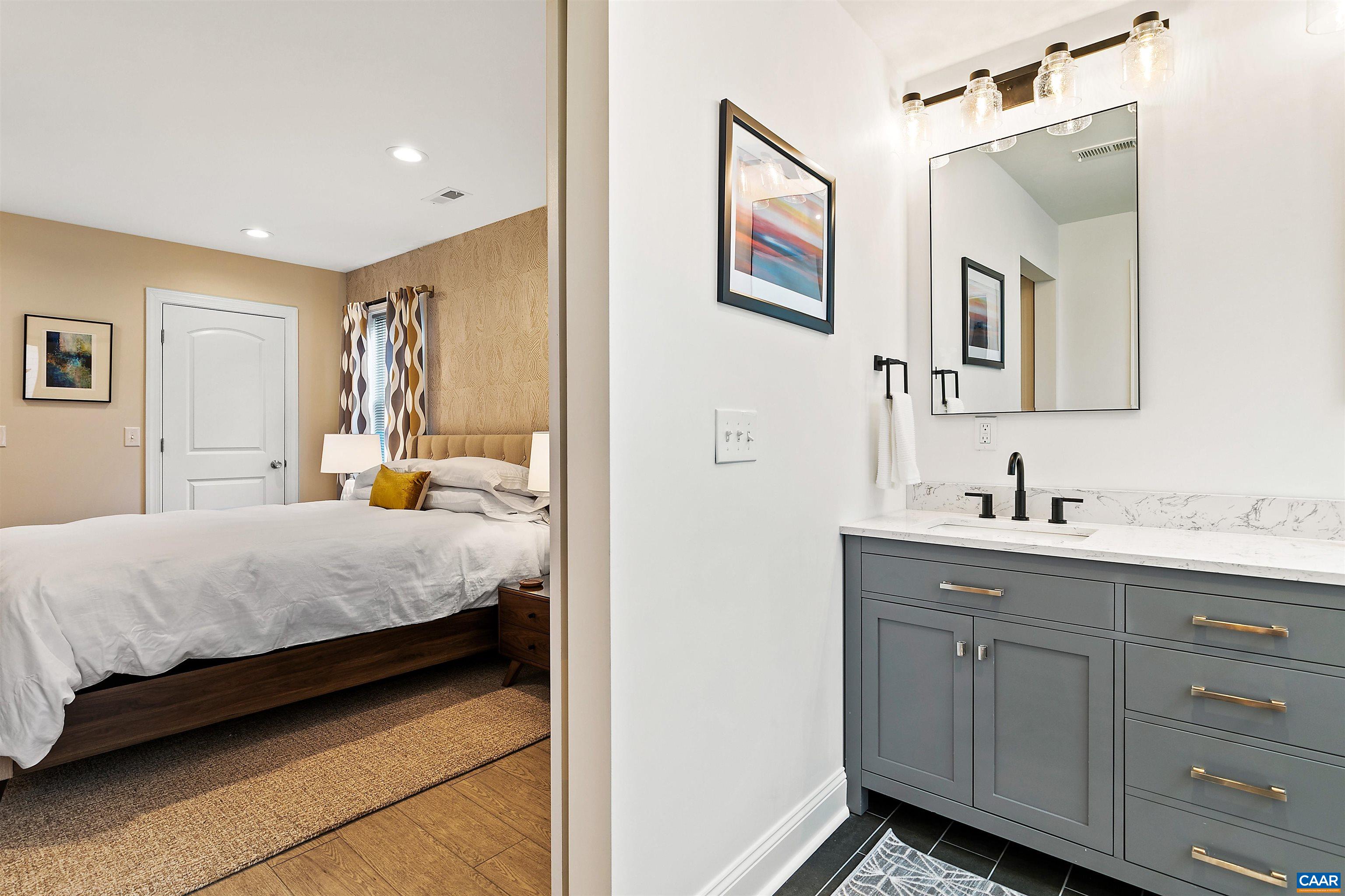 708 West Street Charlottesville, VA 22903 - Photo 13 of 34 a bedroom with a bed and a view of bathroom