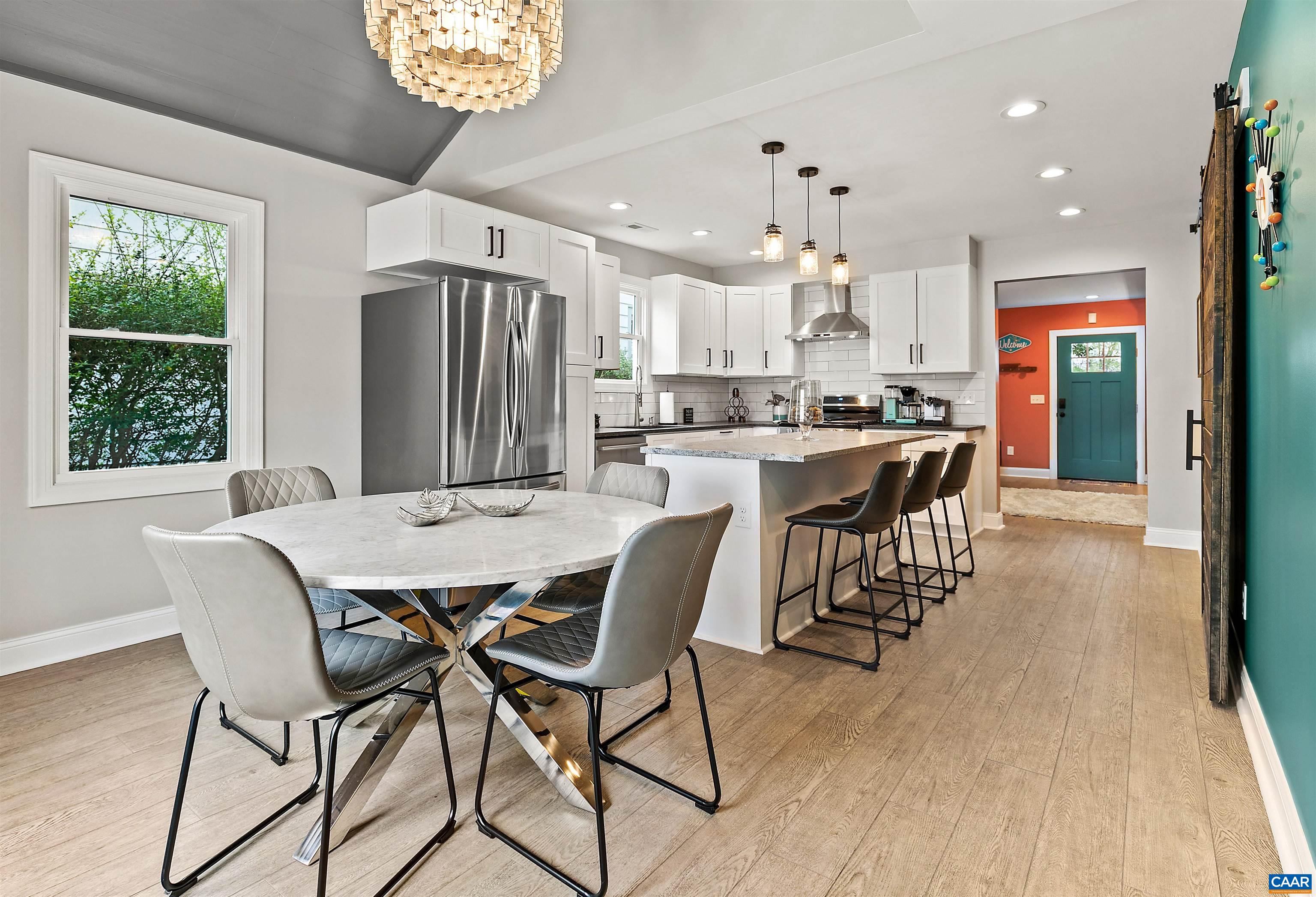 708 West Street Charlottesville, VA 22903 - Photo 16 of 34 a view of a dining room with furniture window and wooden floor