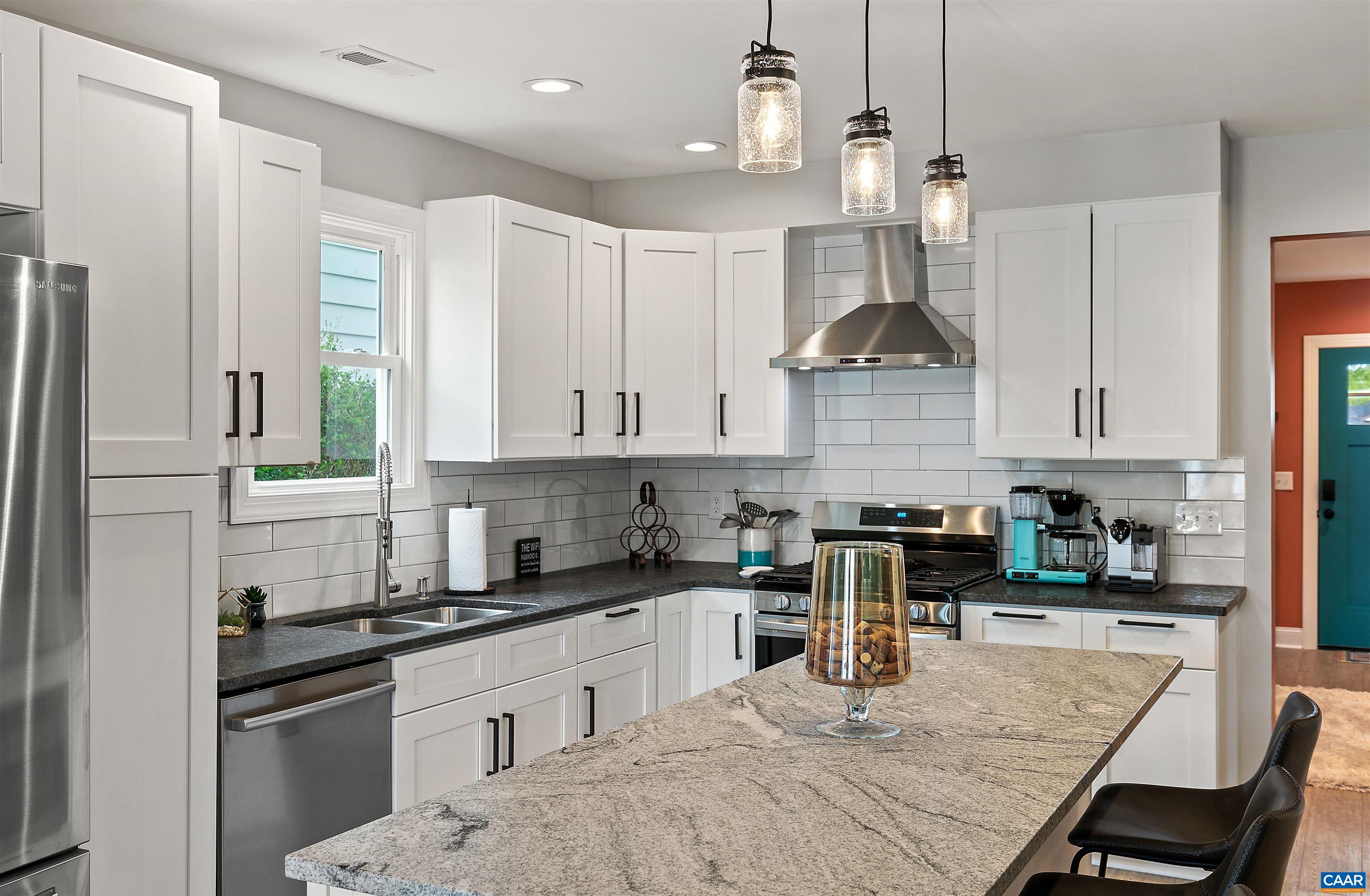 708 West Street Charlottesville, VA 22903 - Photo 18 of 34 a kitchen with stainless steel appliances granite countertop a sink stove and refrigerator