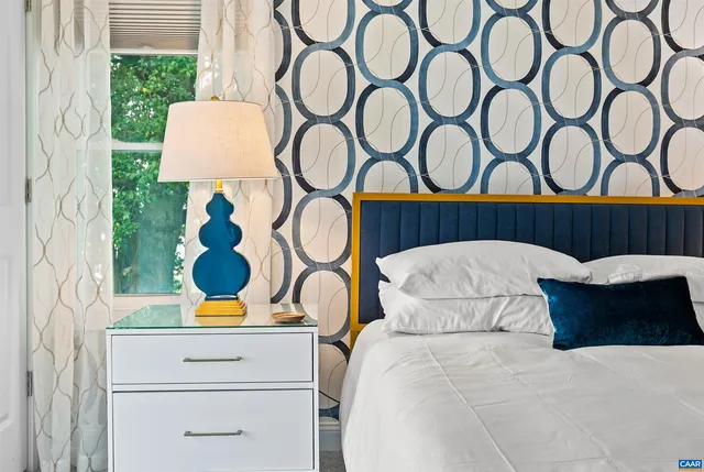a spacious bathroom with a double vanity sink mirror and a bathtub
