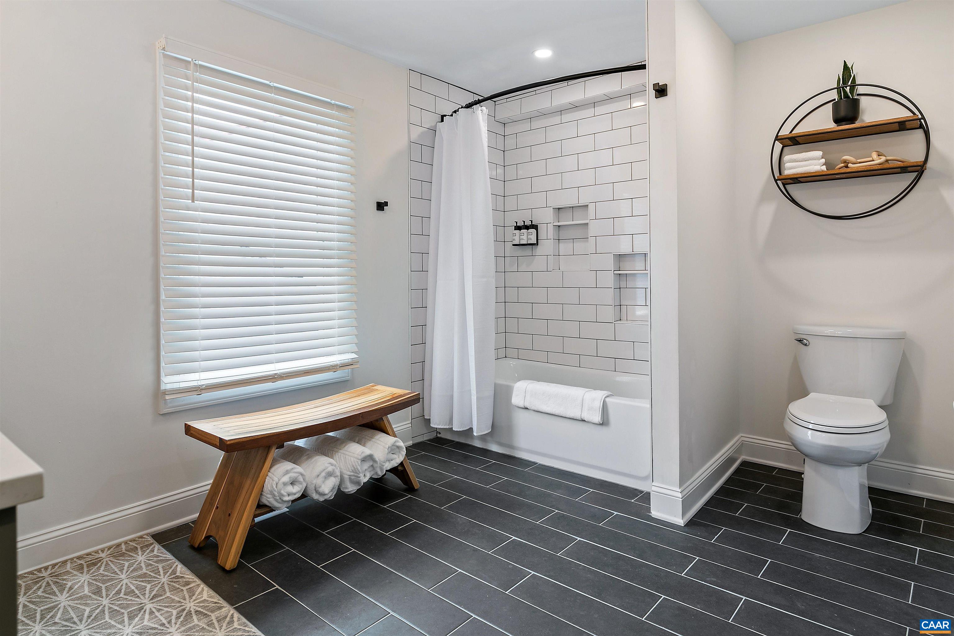 708 West Street Charlottesville, VA 22903 - Photo 30 of 34 a bathroom with a toilet and a shower