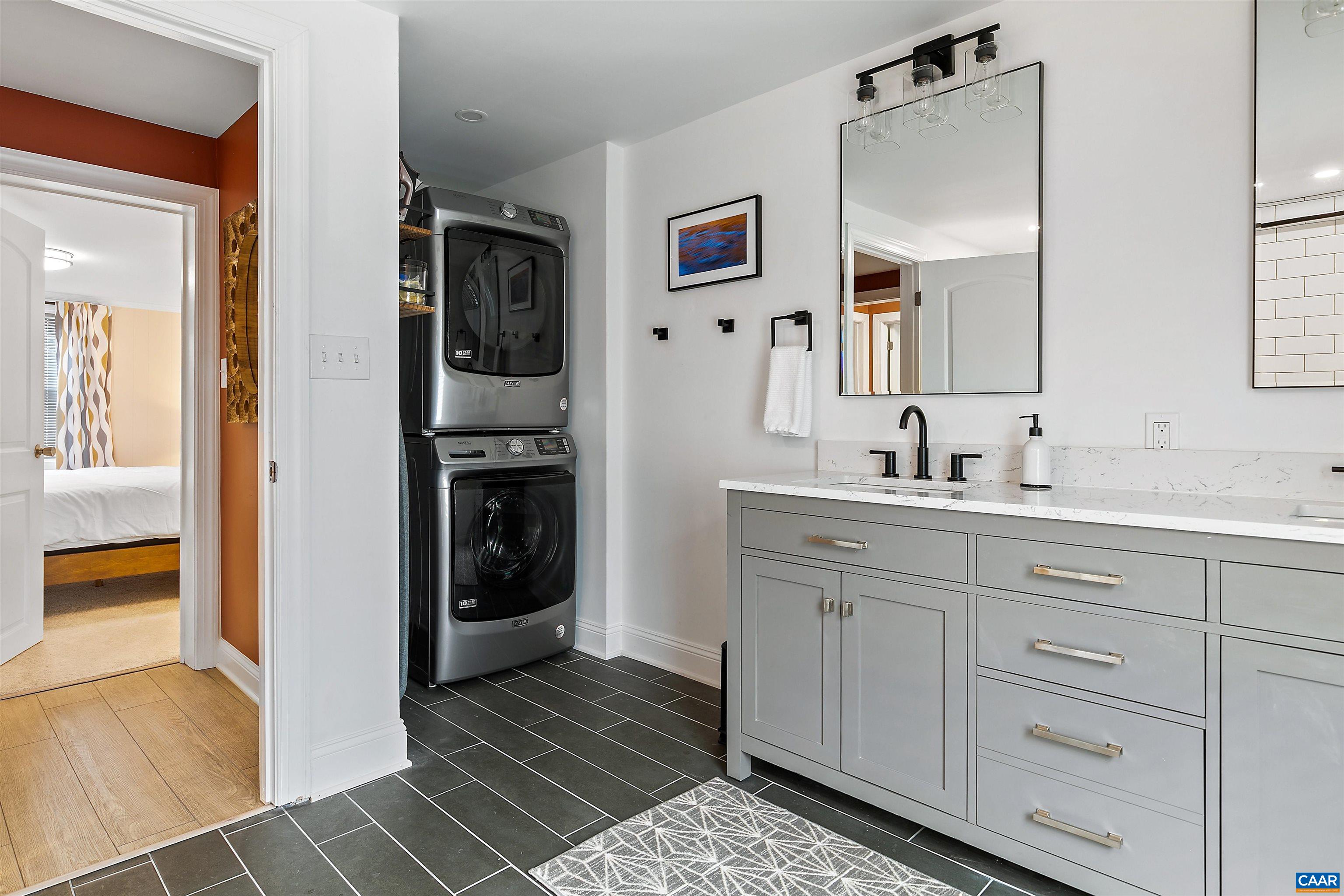 708 West Street Charlottesville, VA 22903 - Photo 31 of 34 a bathroom with a sink and a mirror