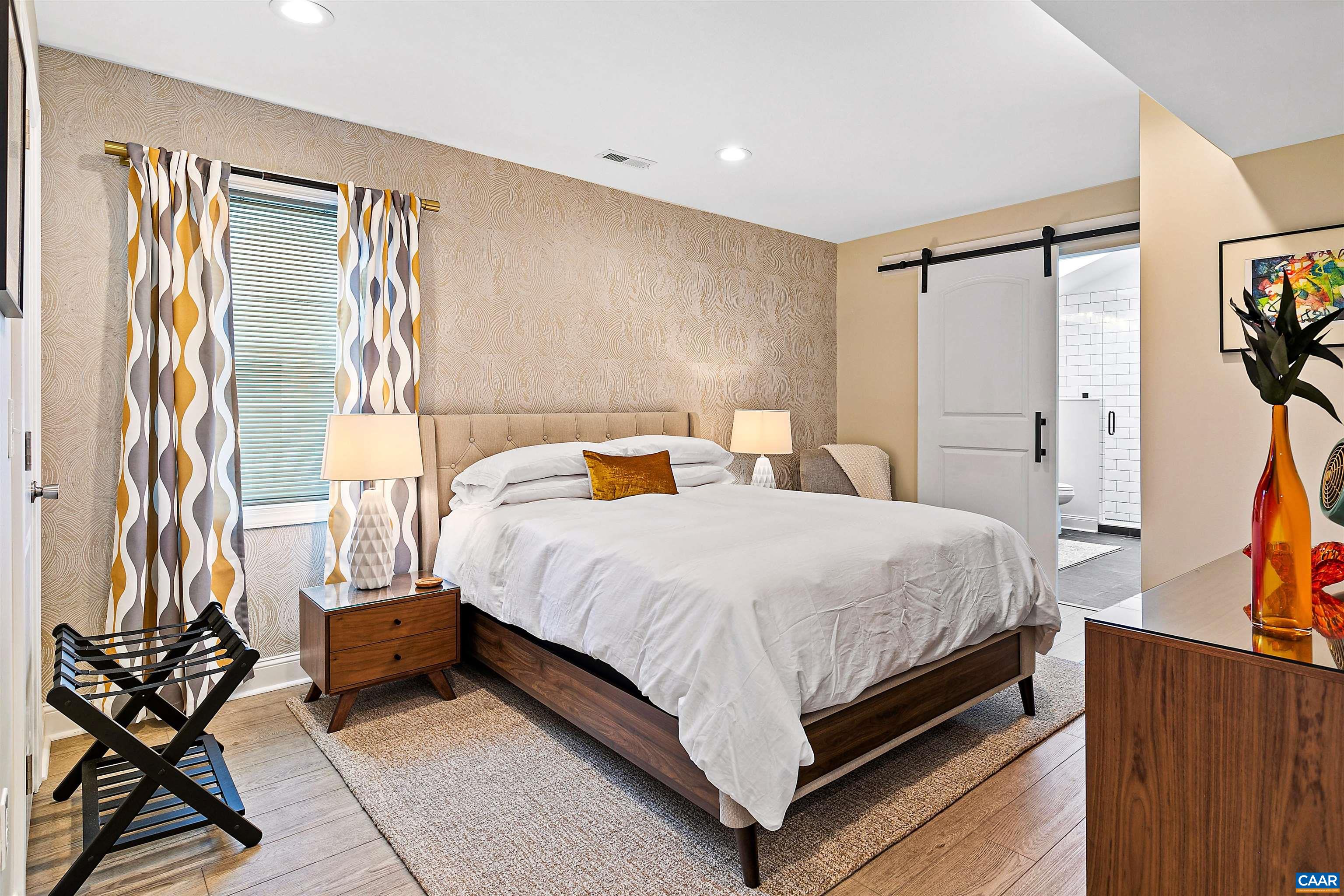 708 West Street Charlottesville, VA 22903 - Photo 10 of 34 a bedroom with a bed and wooden floor