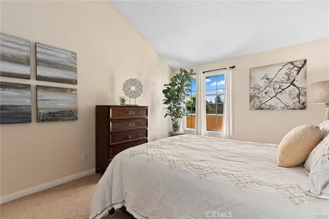 a spacious en suite bathroom with a double vanity sink mirror and shower