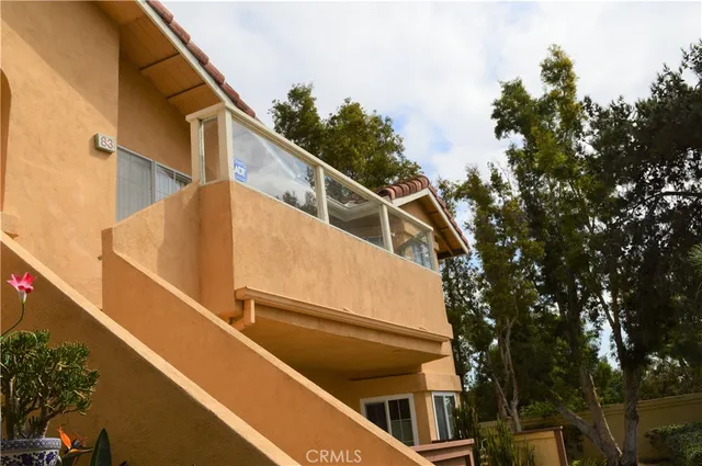 a view of balcony with furniture