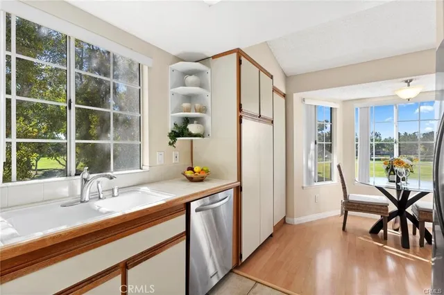 a view of a vase of flowers sitting on a table with window