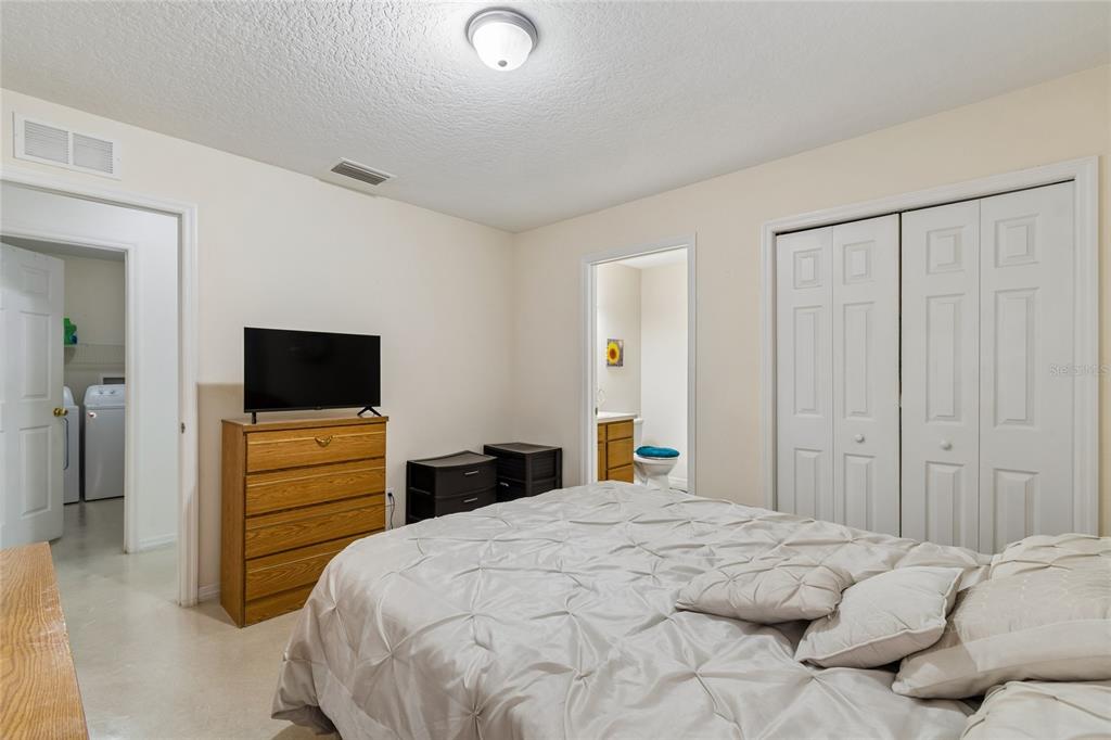 468 North Wheeler Avenue Inverness, FL 34453 - Photo 17 of 24 a bedroom with a bed and a flat screen tv