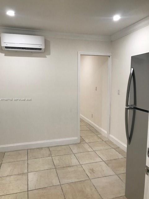 9420 Southwest 55th Street, Unit 2 Miami, FL 33165 - Photo 5 of 9 a view of a refrigerator in kitchen and an empty room