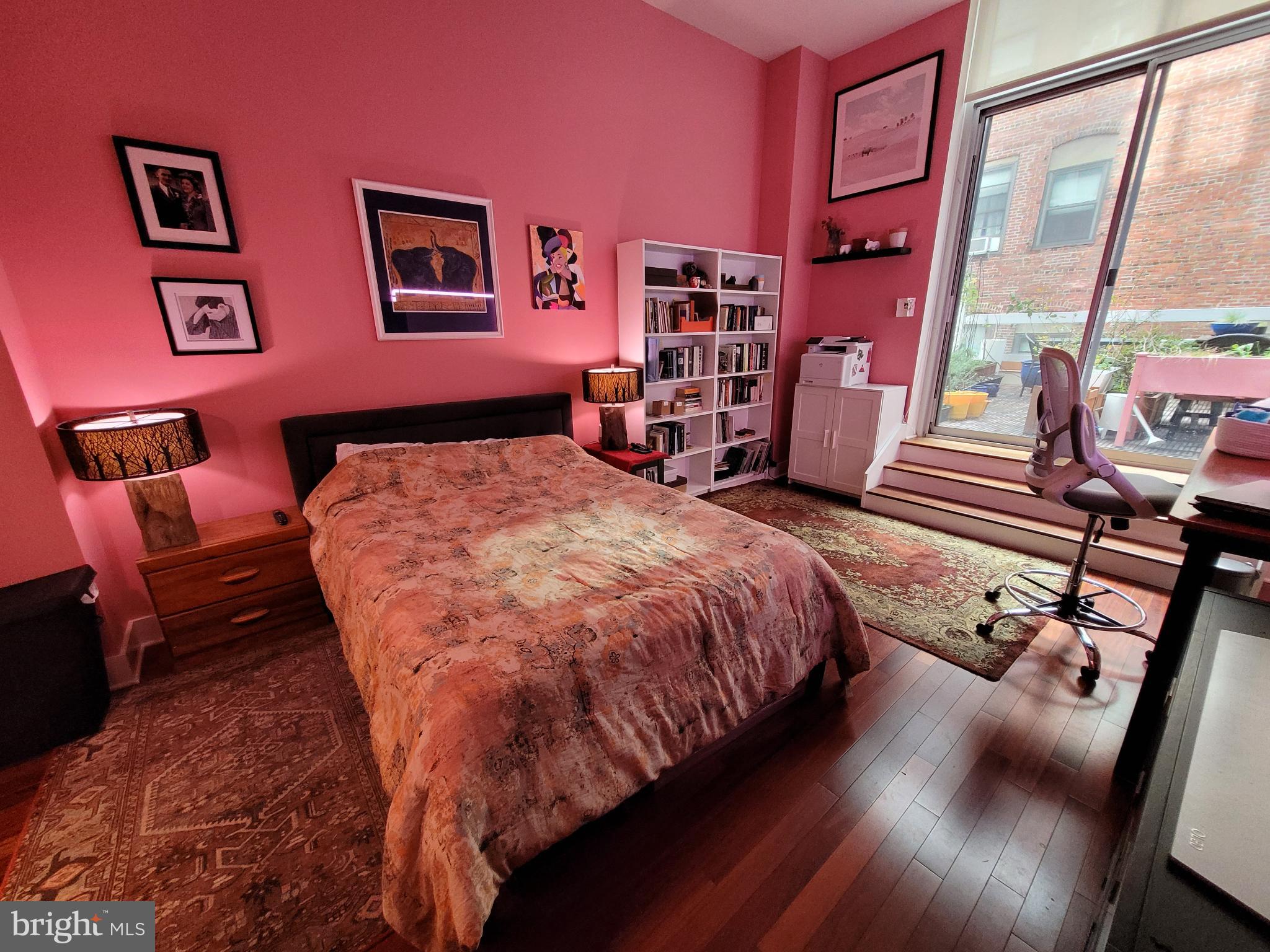 1101 Locust Street, Unit 4L Philadelphia, PA 19107 - Photo 17 of 25 a bed sitting in a bedroom next to a window