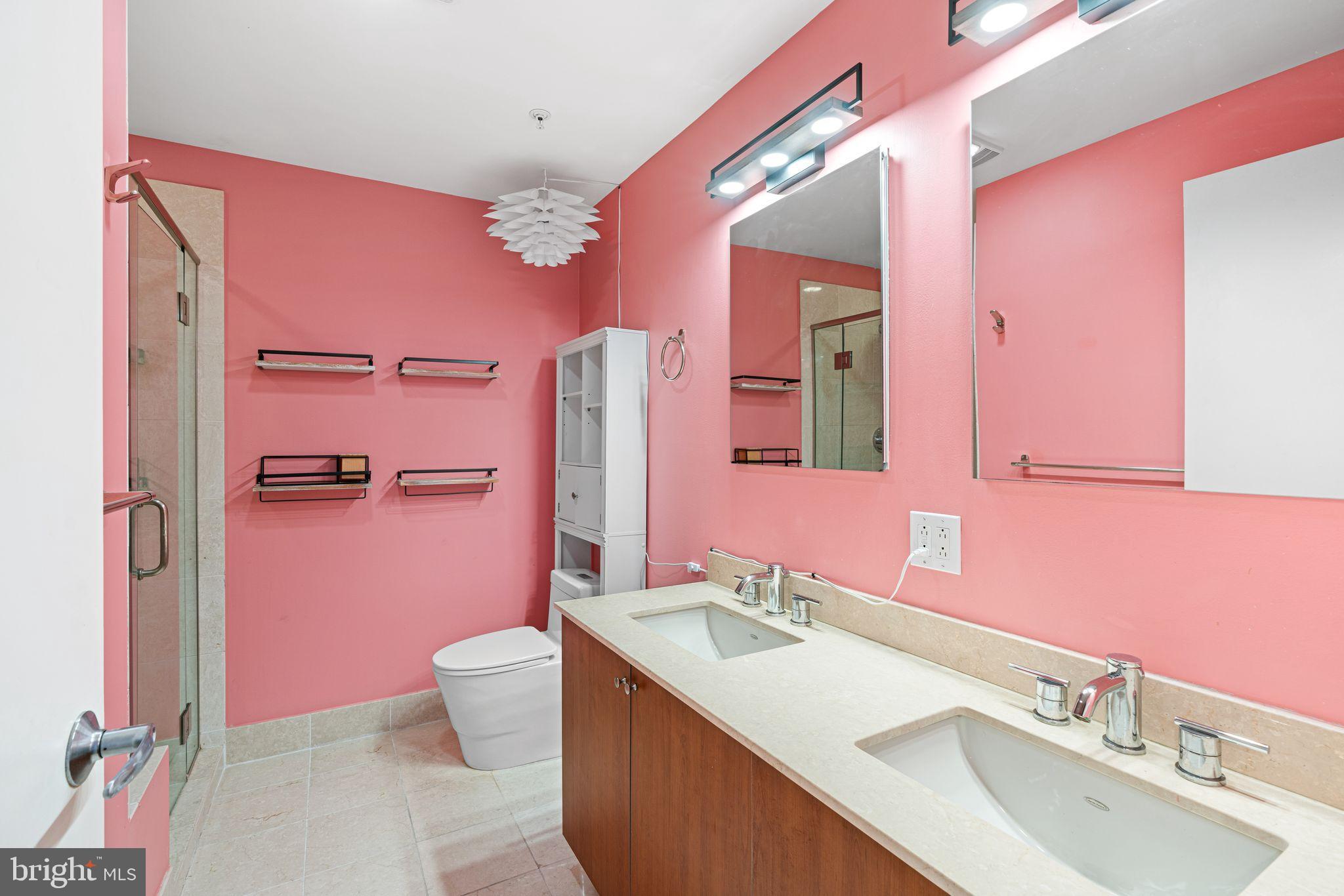 1101 Locust Street, Unit 4L Philadelphia, PA 19107 - Photo 19 of 25 a bathroom with a sink vanity tub and toilet