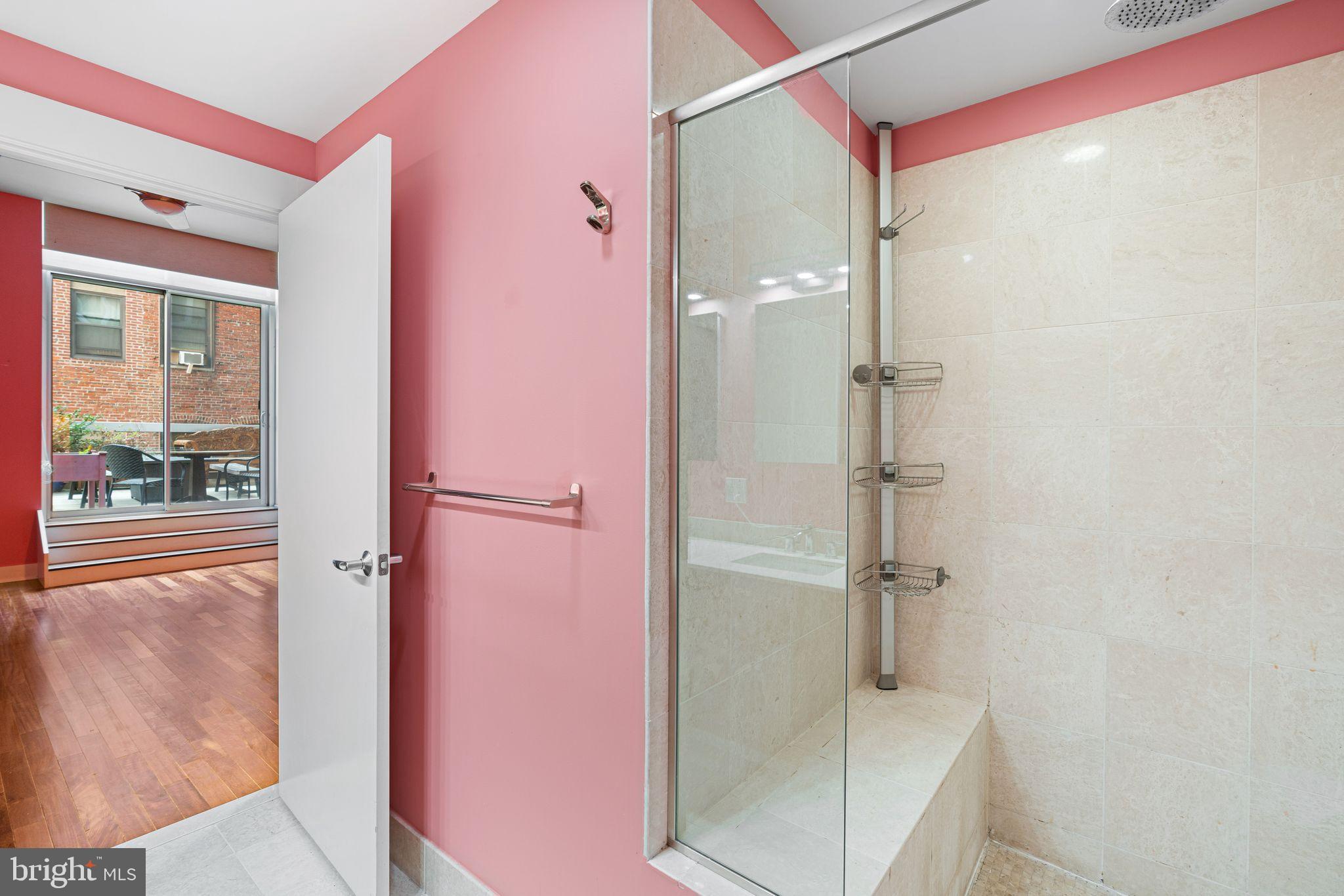 1101 Locust Street, Unit 4L Philadelphia, PA 19107 - Photo 20 of 25 a bathroom with a glass shower door