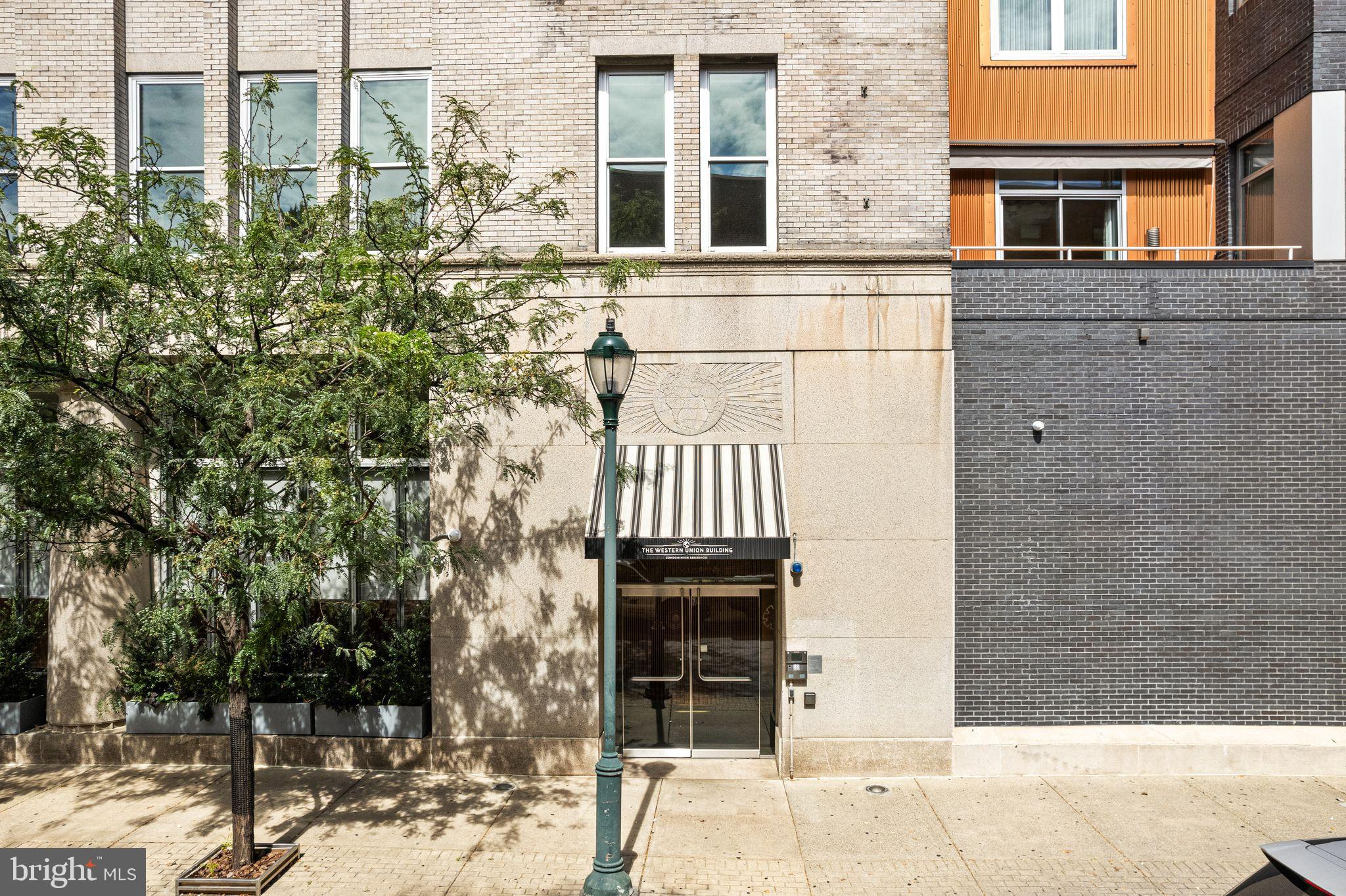 1101 Locust Street, Unit 4L Philadelphia, PA 19107 - Photo 22 of 25 a front view of a house with a yard