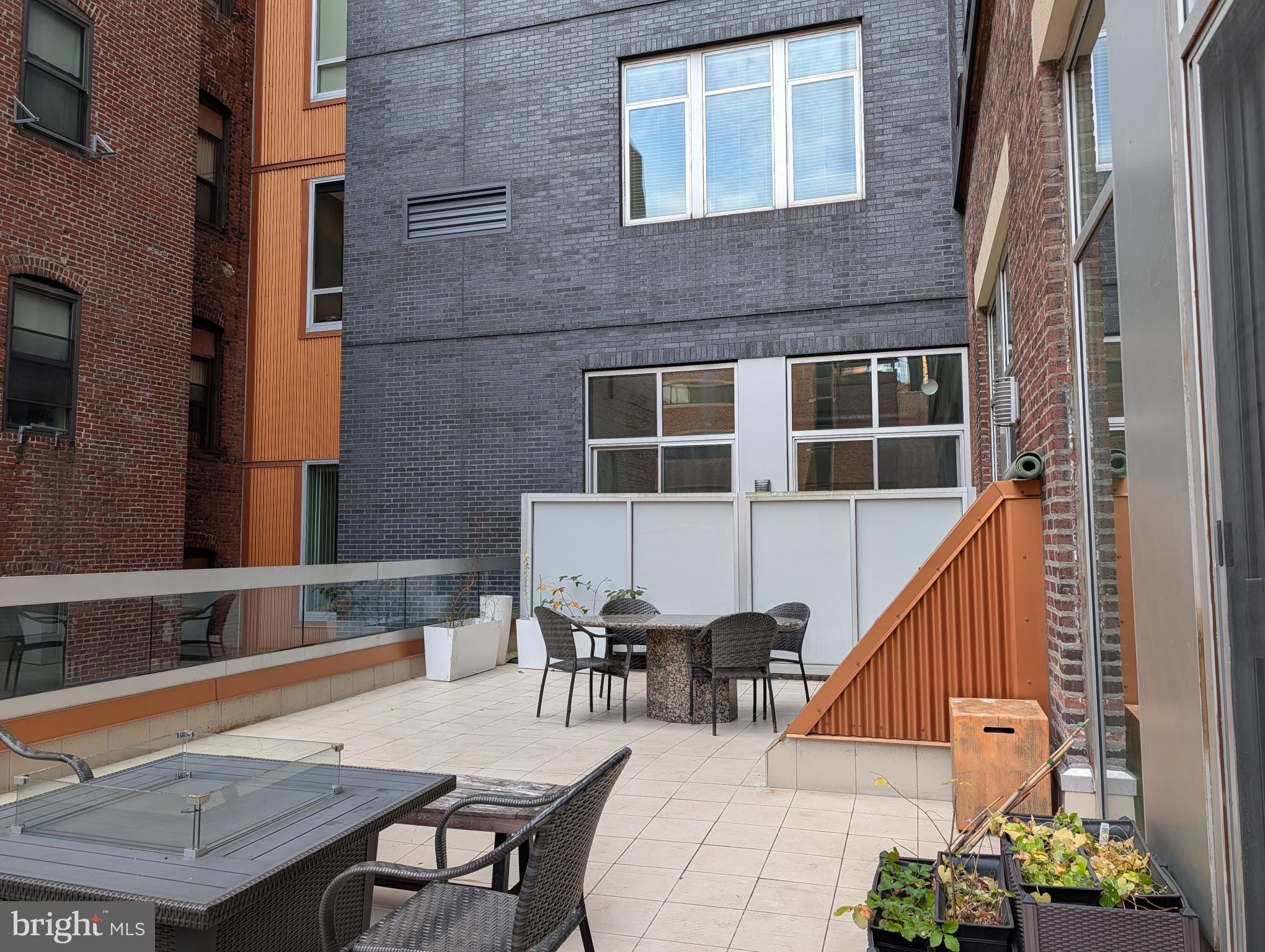 1101 Locust Street, Unit 4L Philadelphia, PA 19107 - Photo 3 of 25 a balcony with table and chairs