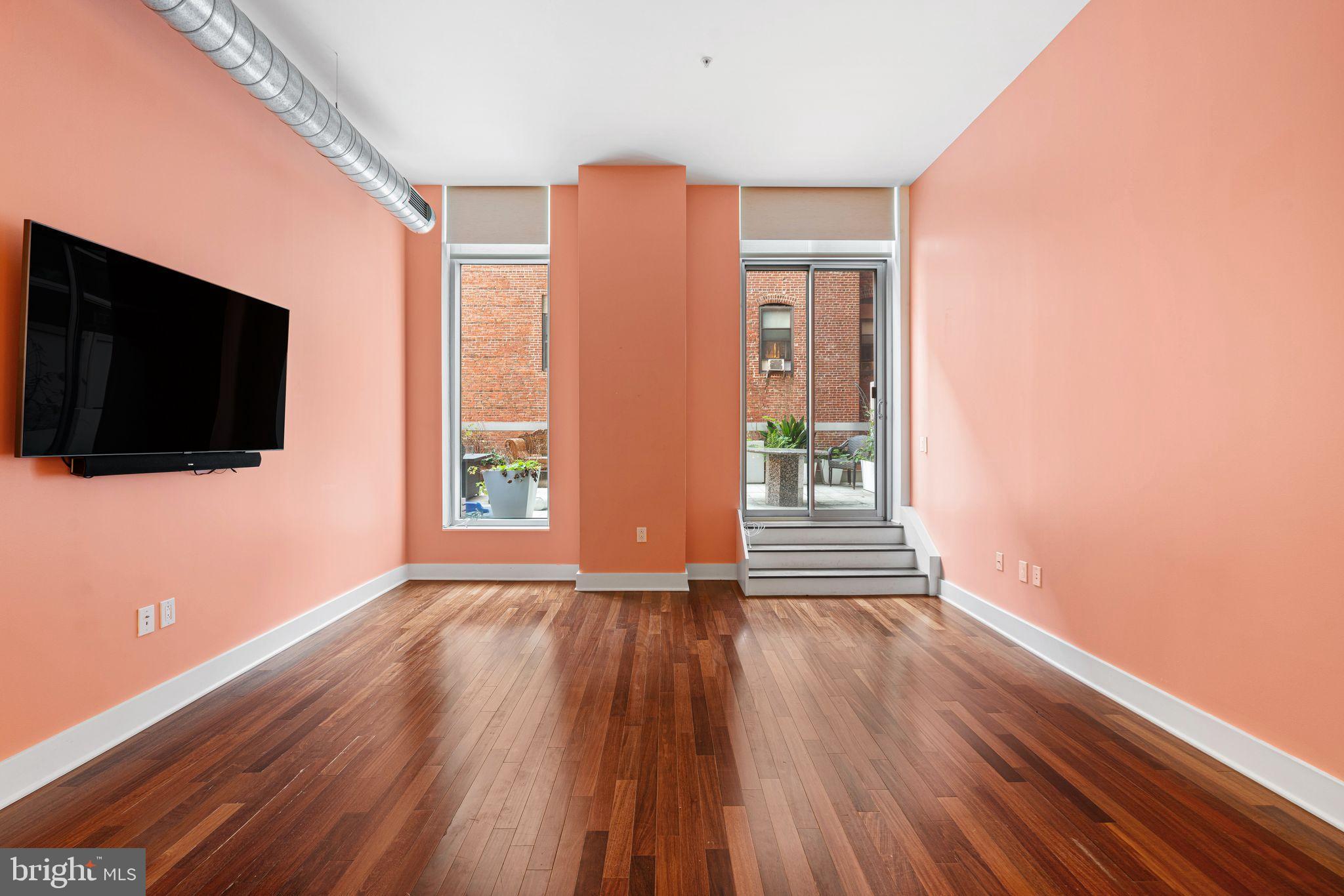1101 Locust Street, Unit 4L Philadelphia, PA 19107 - Photo 10 of 25 a view of empty room with wooden floor and fan