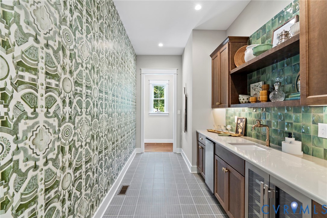 4764 Gooden Trail Quinton, VA 23141 - Photo 16 of 50 Bar with open shelves, light stone countertops, wi