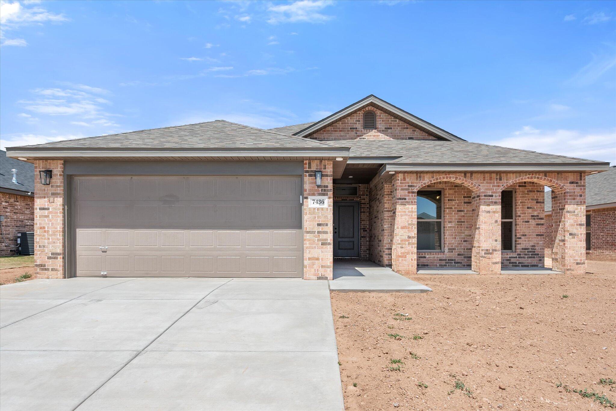 7436 29th Street Lubbock, TX 79407 - Photo 1 of 22 a front view of a house with yard