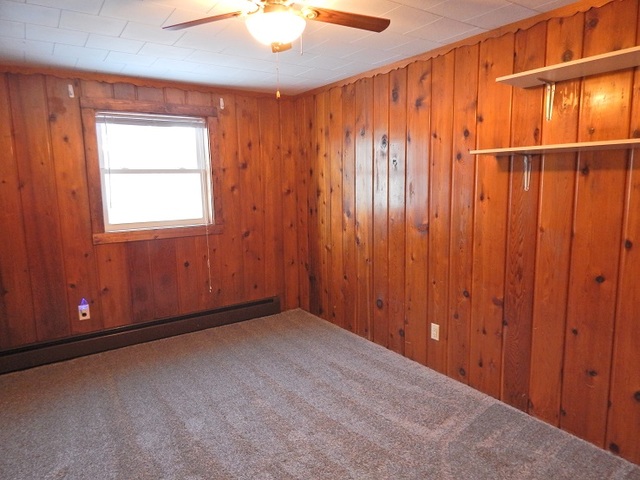 109 South Stott Street, Unit 2 Genoa, IL 60135 - Photo 11 of 14 an empty room with windows