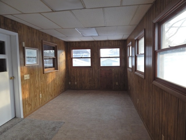 109 South Stott Street, Unit 2 Genoa, IL 60135 - Photo 13 of 14 a view of an empty room with a window
