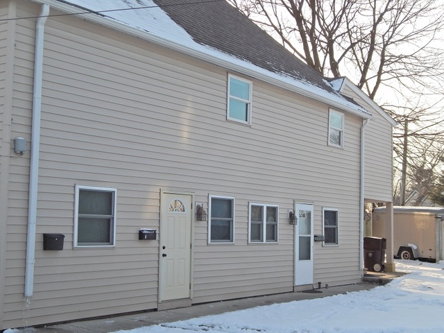 109 South Stott Street, Unit 2 Genoa, IL 60135 - Photo 14 of 14 a front view of a house