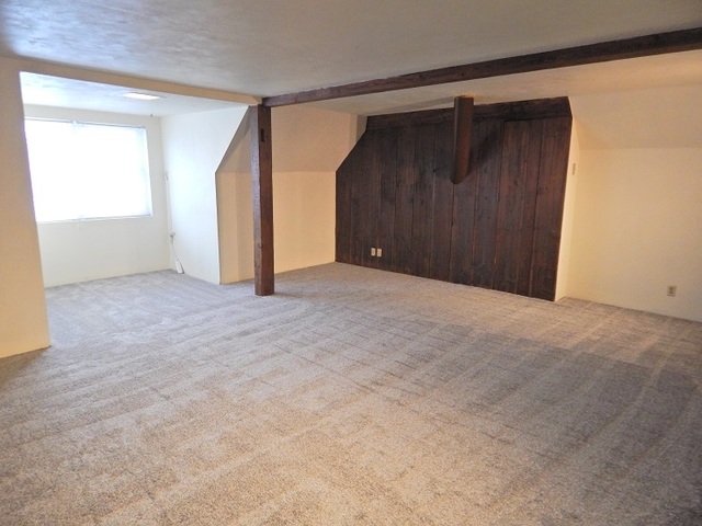 109 South Stott Street, Unit 2 Genoa, IL 60135 - Photo 9 of 14 an empty room with an entryway and door